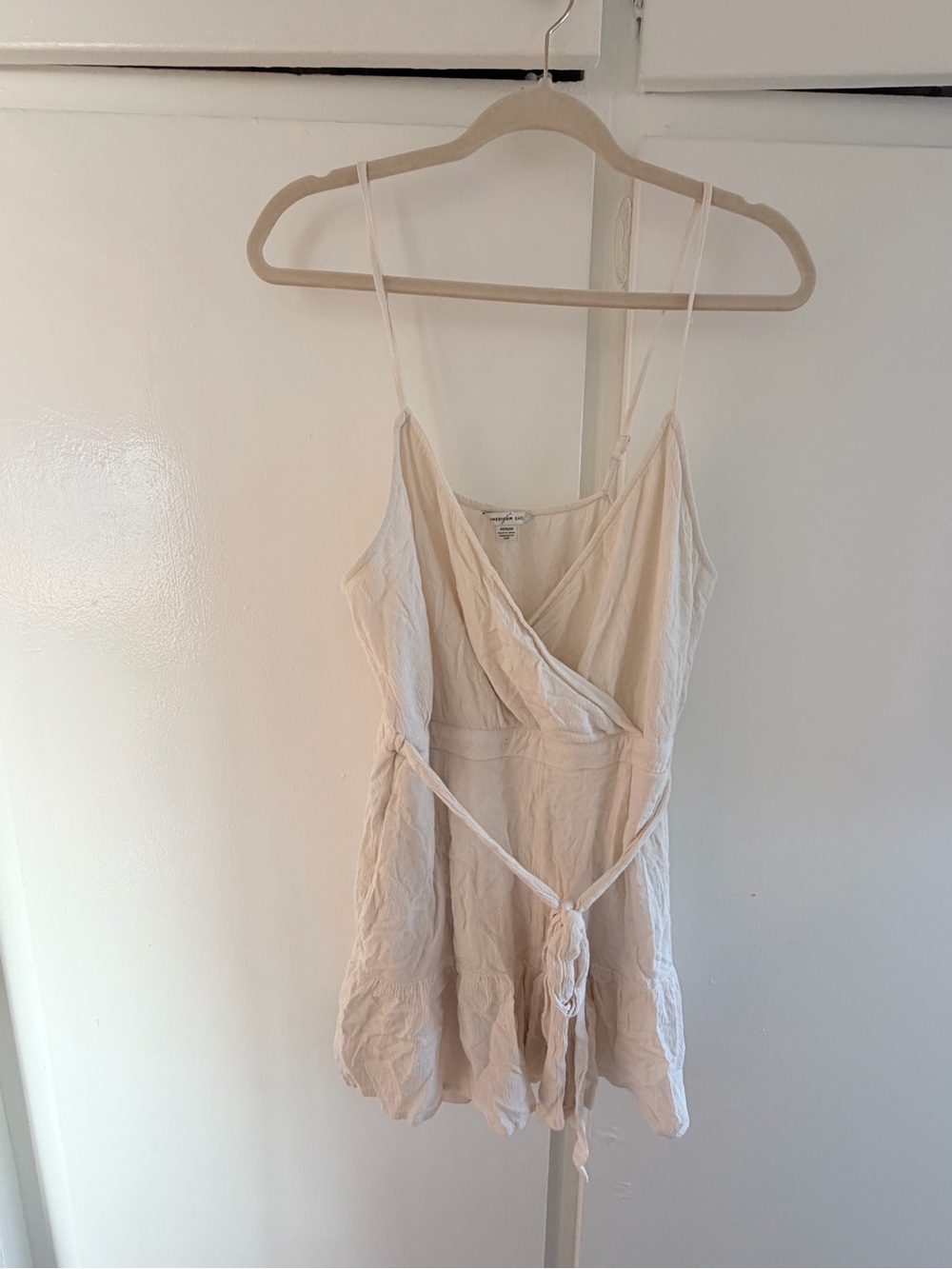 cream american eagle wrap romper with pockets